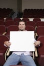 Male Student Sitting With Billboard In Classroom Royalty Free Stock Photo