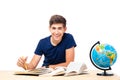 Male student sitting at the table with books Royalty Free Stock Photo