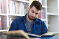Male student studying in the library Royalty Free Stock Photo
