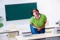 The male student suffering from urge in the classroom