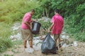 Male Students help to remove rubbish from the classroom Royalty Free Stock Photo