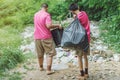 Male Students help to remove rubbish from the classroom Royalty Free Stock Photo