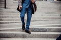 Male in stylish shoes walking down the steps Royalty Free Stock Photo