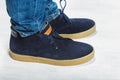 Male suede sneakers close up white background