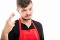 Male supermarket employer holding fingers crossed