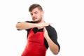 Male supermarket employer showing time out gesture