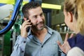 male supervisor talking on mobile phone in industry Royalty Free Stock Photo