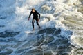 Male surfer enjoying the big wave in Oceanside Royalty Free Stock Photo