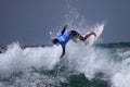 Male surfer jumps a wave