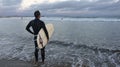 Male surfer at sunset