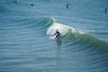 Male surfers enjoying the big wave in Oceanside in North San Diego, California, USA. Royalty Free Stock Photo