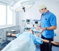 Male surgeon on background in operation room Royalty Free Stock Photo