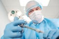 Male surgeon holding syringe isolated on a white background. Focus on syringe Royalty Free Stock Photo