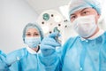 Male surgeon holding syringe isolated on a white background. Focus on syringe Royalty Free Stock Photo