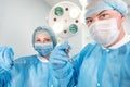 Male surgeon holding syringe isolated on a white background. Focus on syringe Royalty Free Stock Photo