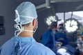 Male surgeon standing in operation room at hospital Royalty Free Stock Photo