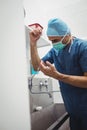 Male surgeon washing hands prior to operation using correct technique for cleanliness Royalty Free Stock Photo