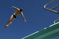 Male Swimmer Diving From Springboard