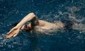 male swimmer, free style swimming on the swimming track in the indoor pool