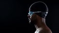 Male swimmer wearing goggles and preparing to jump into swimming pool, close-up Royalty Free Stock Photo