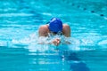 Male swimmer working on his breaststroke swimming at a local po