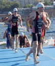 Male swimmers climbing up from the water Royalty Free Stock Photo