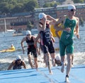 Male swimmers climbing up from the water Royalty Free Stock Photo