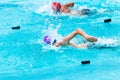 Male swimmers competing in freestyle stroke Royalty Free Stock Photo