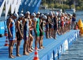 Male swimming competitors waiting for the start signal