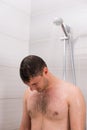 Male taking a shower in the bathroom Royalty Free Stock Photo