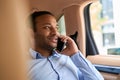 Male talking on mobile phone in automobile