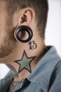 Male with tattoos and piercing Royalty Free Stock Photo