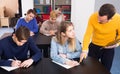 Male teacher clearing up complicated issue to pupil during exam Royalty Free Stock Photo