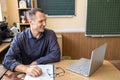 Male teacher having online class through video call and explaining maths. e-learning via interactive platform. Royalty Free Stock Photo