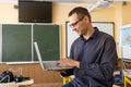 Male teacher having online class through video call and explaining maths. e-learning via interactive platform. Royalty Free Stock Photo