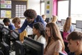 Male Teacher Helping Teenage Female High School Student Working In Computer Class Royalty Free Stock Photo