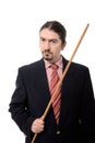 Male teacher holding a long wooden stick