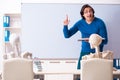 The male teacher and skeleton student in the classroom Royalty Free Stock Photo