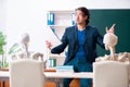 Male teacher and skeleton student in the classroom Royalty Free Stock Photo