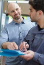 male teacher and student working on class work Royalty Free Stock Photo