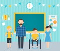 Male Teacher and Young Students in Classroom. Including Students with Special Needs Concept Royalty Free Stock Photo