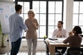 Businessman handshake middle-aged female employee greeting with promotion Royalty Free Stock Photo