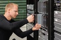 Male Technical Consultant Replacing Blade Server In SAN At Datacenter Royalty Free Stock Photo