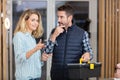 Male technician assisting woman at home Royalty Free Stock Photo