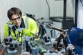 Male technician engineer checking automation robotics at industrial modern factory. man working at factory innovation automation Royalty Free Stock Photo