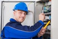 Male Technician Examining Fusebox Royalty Free Stock Photo