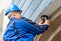 Male Technician Installing Camera