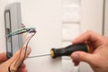 Male technician installing fingerprint security alarm system, closeup