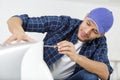 Male technician repairing air conditioner at home Royalty Free Stock Photo