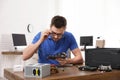 Male technician repairing computer at table Royalty Free Stock Photo